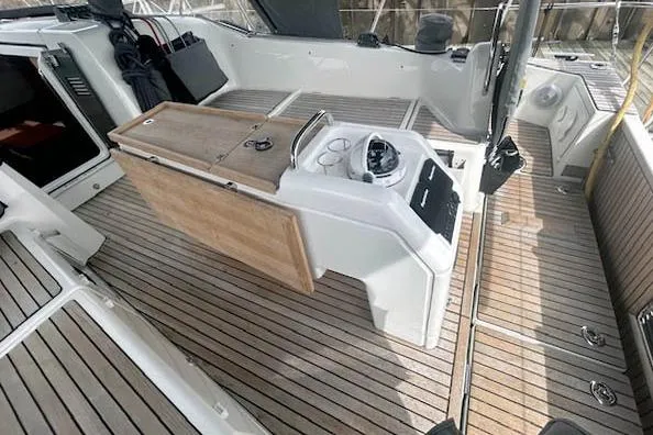 Dream Weaver Yacht Photos Pics 2022 Jeanneau Sun Odyssey 410 cockpit with wooden flooring and modern helm station.