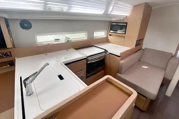 Dream Weaver Yacht Photos Pics Modern kitchen interior of 2022 Jeanneau Sun Odyssey 410 yacht with sleek design.