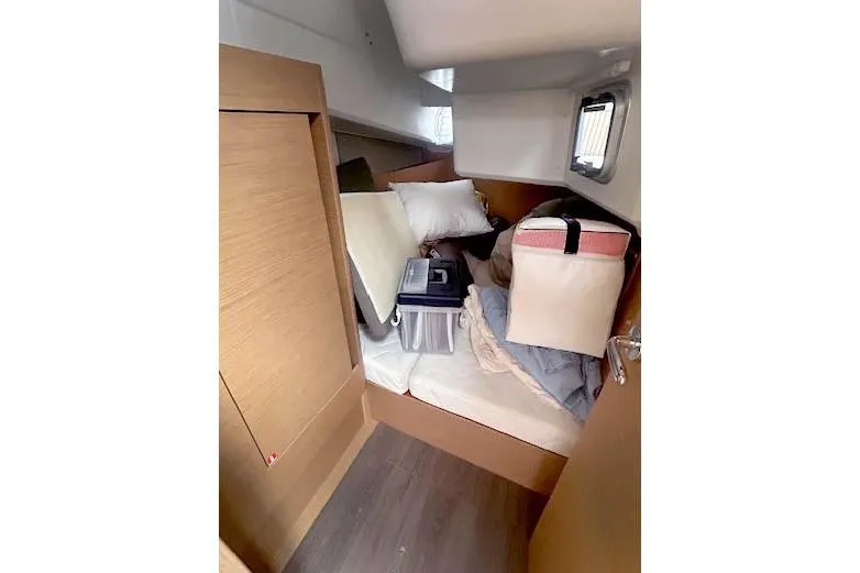 Dream Weaver Yacht Photos Pics Interior cabin of 2022 Jeanneau Sun Odyssey 410 with storage items.