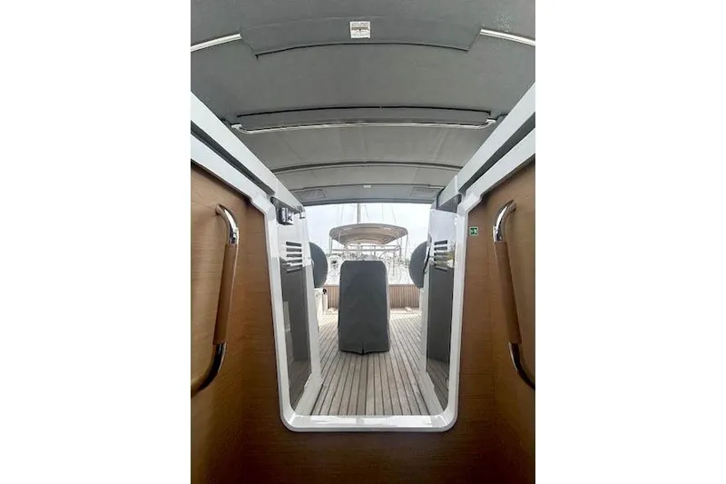 Dream Weaver Yacht Photos Pics Interior view of 2022 Jeanneau Sun Odyssey 410 sailboat, featuring sleek design and wooden accents.