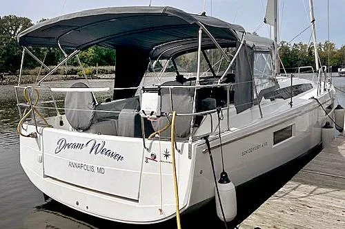 Dream Weaver Yacht Photos Pics 2022 Jeanneau Sun Odyssey 410 docked in Annapolis, MD, with canopy and seating.
