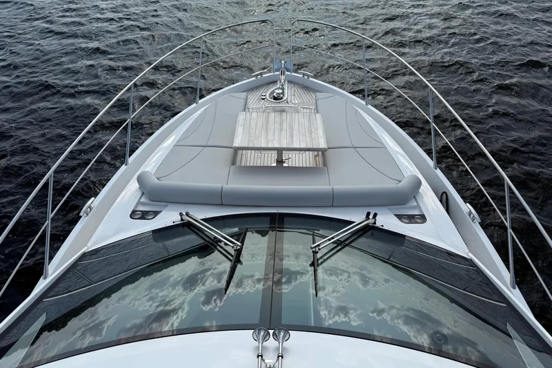  Yacht Photos Pics 2024 Sunseeker Manhattan 55 yacht bow with sleek design on open water.