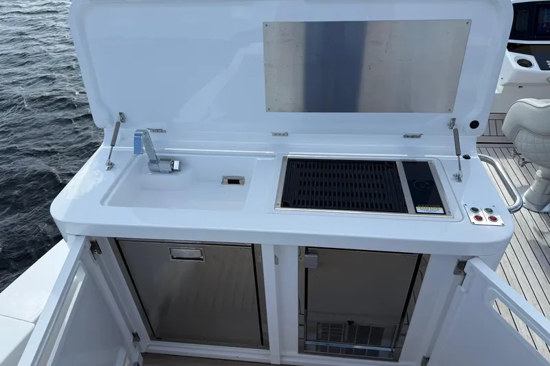  Yacht Photos Pics Outdoor kitchen on 2024 Sunseeker Manhattan 55 yacht with sink and grill.
