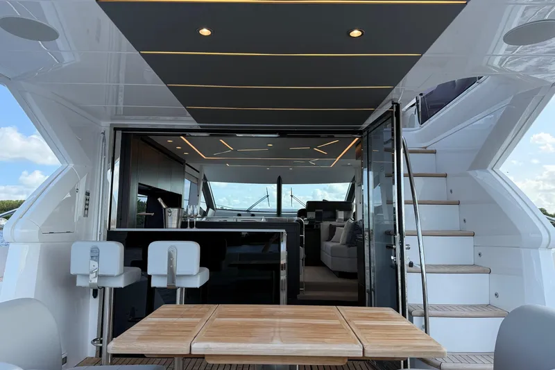  Yacht Photos Pics Luxurious 2024 Sunseeker Manhattan 55 yacht interior with modern design and elegant seating area.