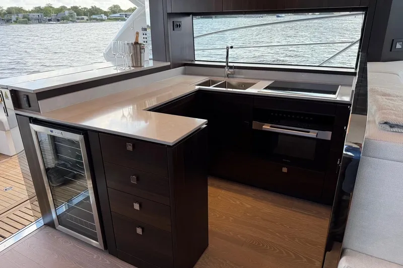  Yacht Photos Pics Luxurious kitchen interior of 2024 Sunseeker Manhattan 55 yacht with modern appliances.
