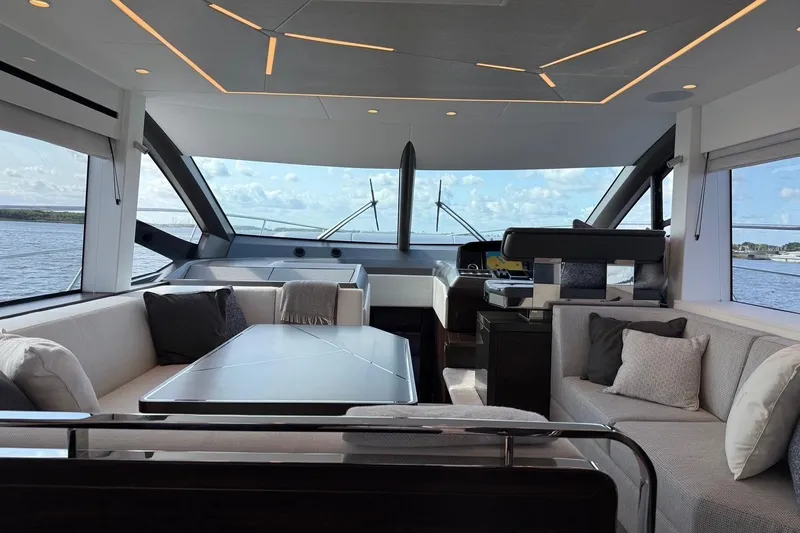  Yacht Photos Pics Luxurious interior of 2024 Sunseeker Manhattan 55 yacht with modern seating and panoramic windows.