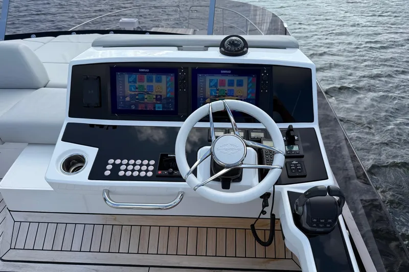  Yacht Photos Pics 2024 Sunseeker Manhattan 55 yacht helm with modern navigation displays and controls.