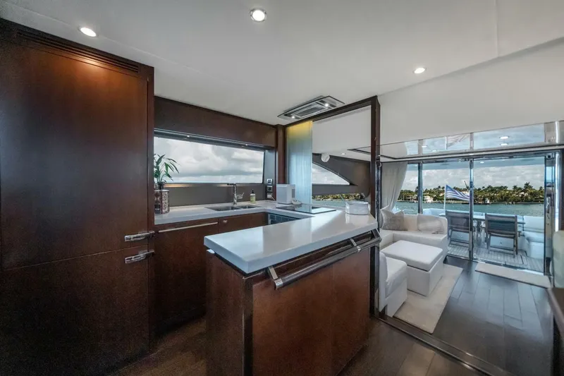 Aquavita Yacht Photos Pics Luxurious interior of 2012 Princess 64 Flybridge Motor Yacht with modern kitchen and scenic view.