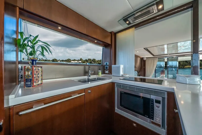 Aquavita Yacht Photos Pics Luxurious kitchen interior of 2012 Princess 64 Flybridge Motor Yacht with modern appliances.