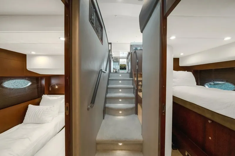 Aquavita Yacht Photos Pics Luxurious interior of 2012 Princess 64 Flybridge Motor Yacht with elegant bedrooms and staircase.