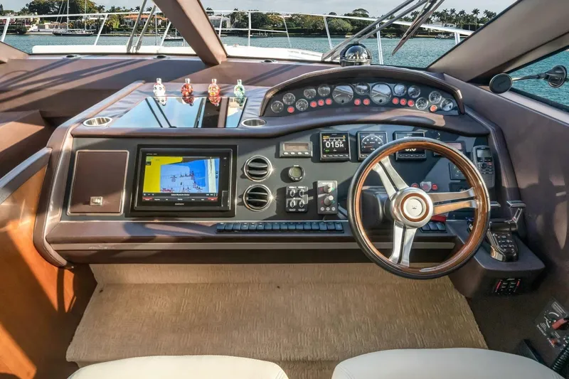 Aquavita Yacht Photos Pics Cockpit of 2012 Princess 64 Flybridge Motor Yacht with advanced navigation controls.