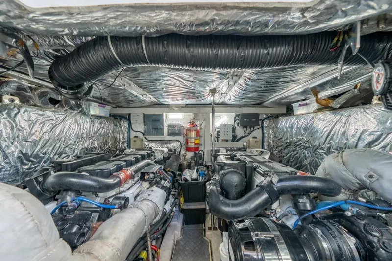 Aquavita Yacht Photos Pics Engine room of 2012 Princess 64 Flybridge Motor Yacht, showcasing dual engines and equipment.