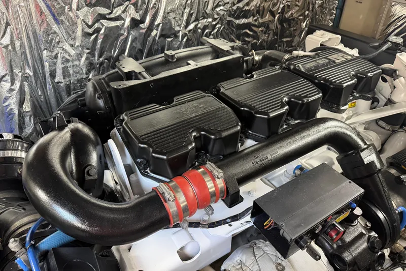 Aquavita Yacht Photos Pics Engine room of a 2012 Princess 64 Flybridge Motor Yacht, showcasing detailed machinery.