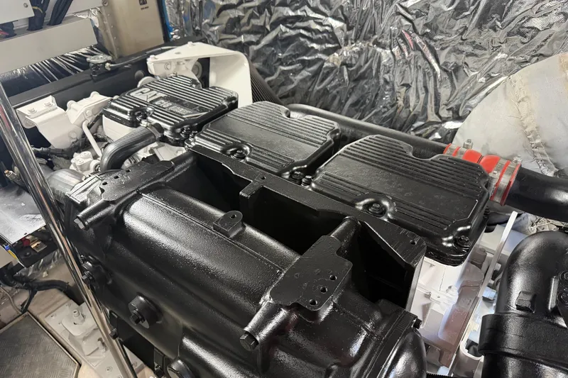 Aquavita Yacht Photos Pics Engine room of a 2012 Princess 64 Flybridge Motor Yacht, showcasing detailed machinery.