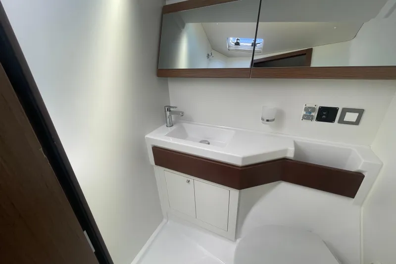 Dire Wolf Yacht Photos Pics Modern bathroom interior of 2020 Beneteau Oceanis 46.1 yacht with sleek fixtures.