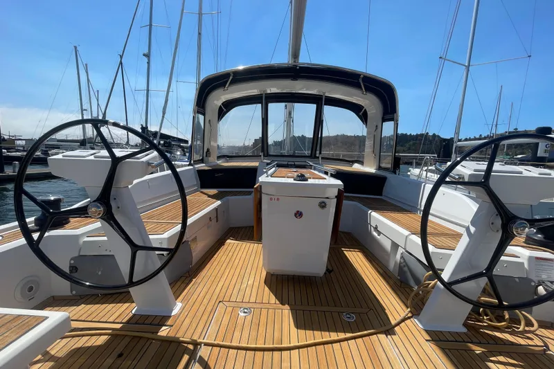 Dire Wolf Yacht Photos Pics 2020 Beneteau Oceanis 46.1 yacht cockpit with dual steering wheels and teak decking.