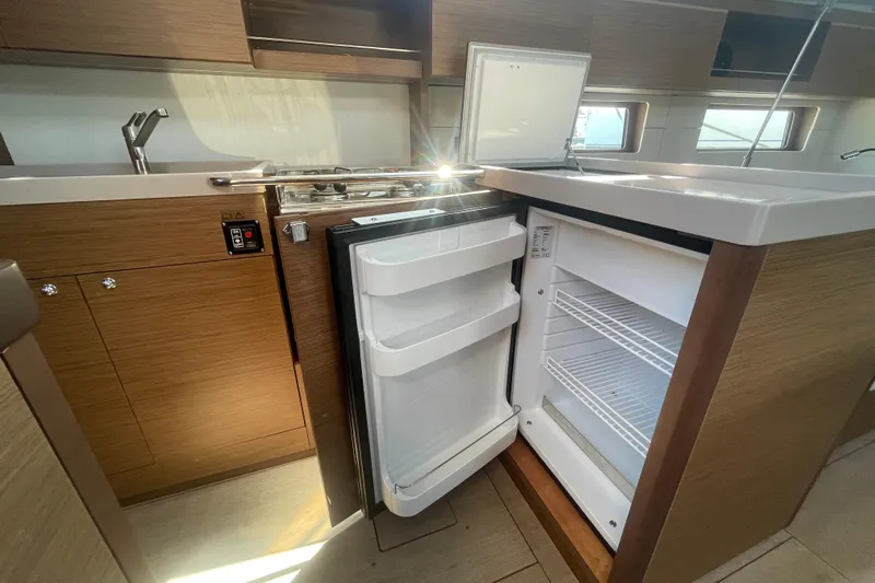 Dire Wolf Yacht Photos Pics Modern kitchen in 2020 Beneteau Oceanis 46.1 yacht with open fridge and sleek design.