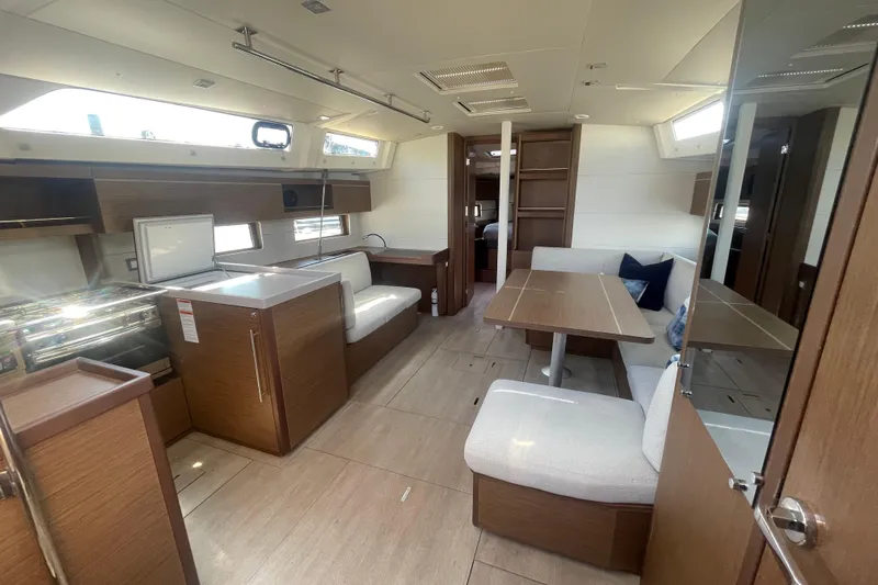 Dire Wolf Yacht Photos Pics Interior of 2020 Beneteau Oceanis 46.1 yacht, featuring modern kitchen and dining area.
