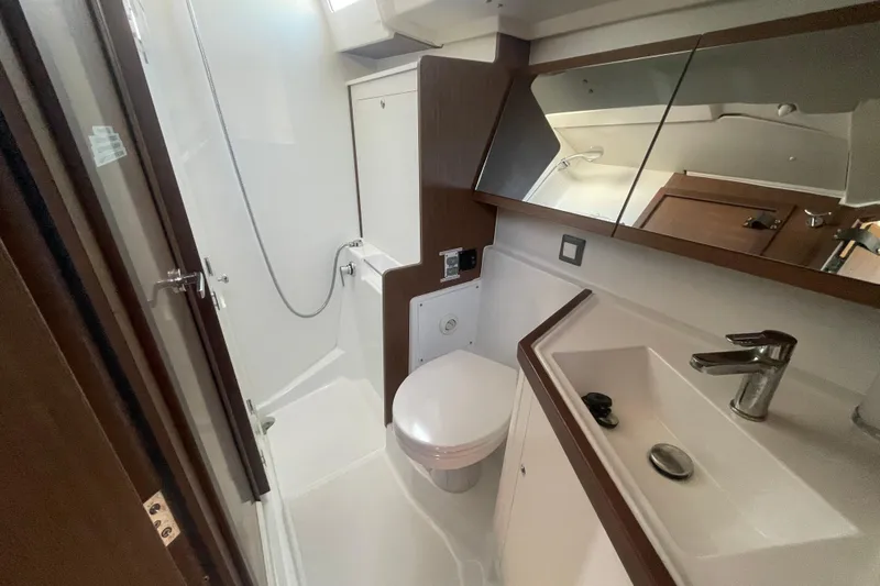 Dire Wolf Yacht Photos Pics Bathroom interior of 2020 Beneteau Oceanis 46.1 yacht, featuring modern fixtures and sleek design.