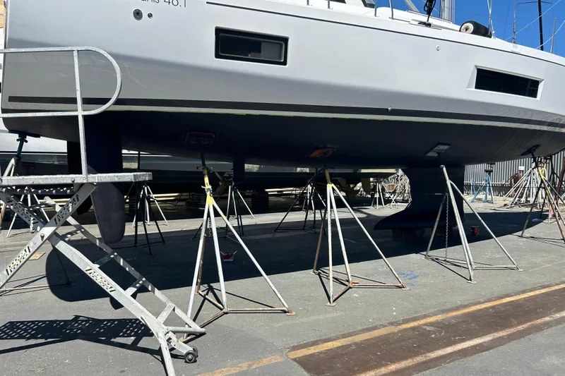 Dire Wolf Yacht Photos Pics Beneteau Oceanis 46.1 sailboat on stands, 2020 model, in a shipyard.