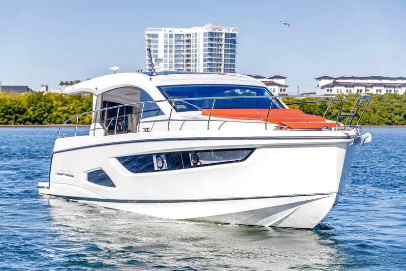  Yacht Photos Pics Sealine C390 yacht cruising on water, 2020 model, with modern design and cityscape background.