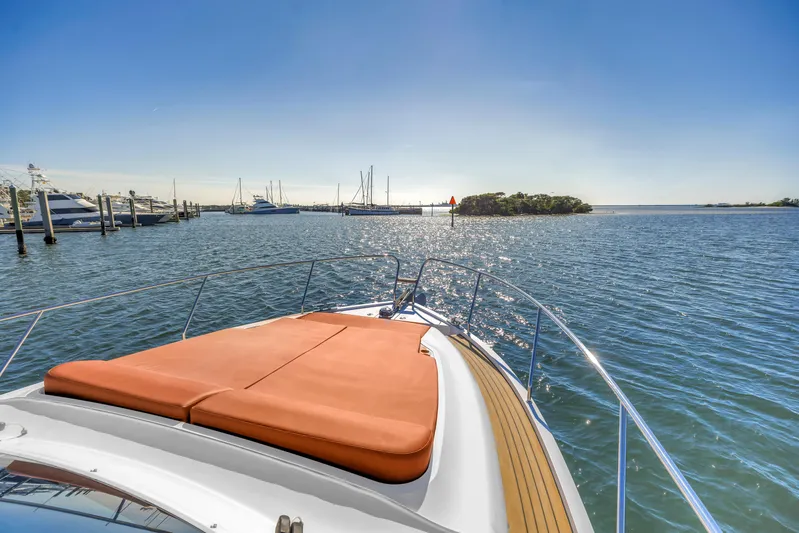  Yacht Photos Pics 2020 Sealine C390 yacht cruising on a sunny day with scenic ocean view.