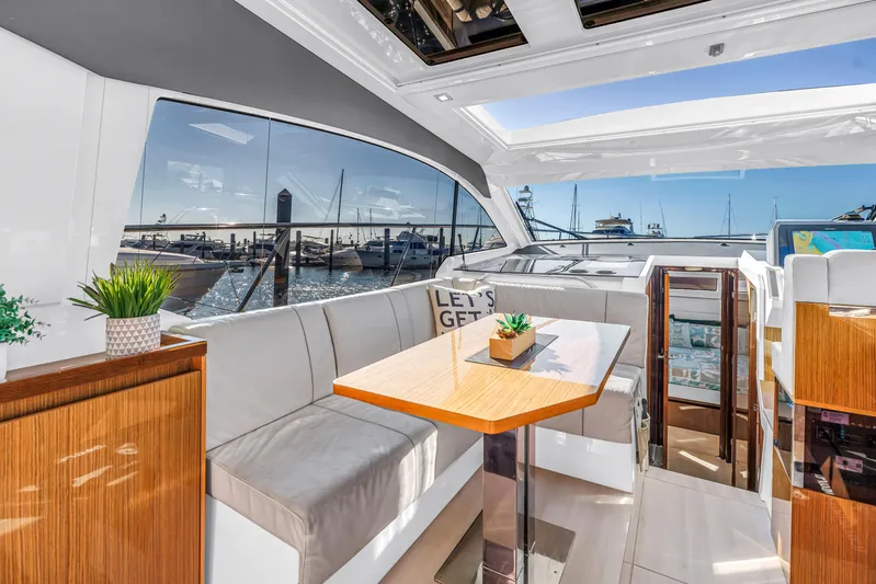  Yacht Photos Pics Luxurious interior of 2020 Sealine C390 yacht with panoramic windows and elegant seating.