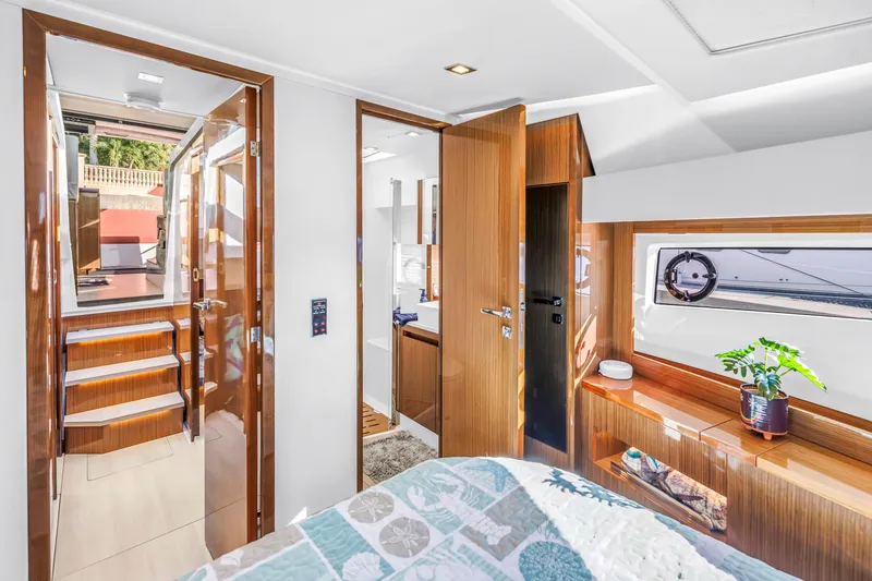  Yacht Photos Pics Luxurious interior of 2020 Sealine C390 yacht with modern wood finishes and natural light.
