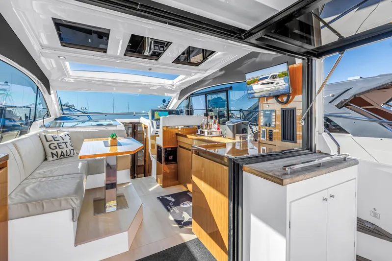  Yacht Photos Pics Luxurious interior of 2020 Sealine C390 yacht with modern amenities and open seating area.