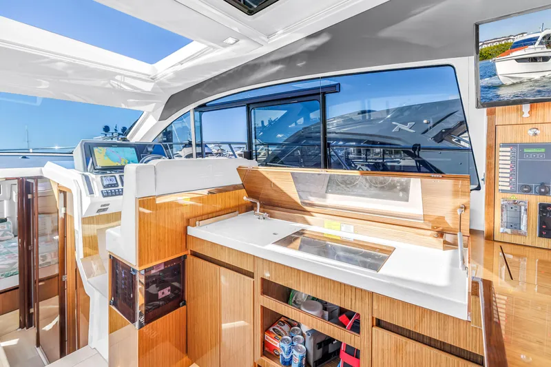  Yacht Photos Pics Interior of 2020 Sealine C390 yacht with modern navigation and kitchen area.