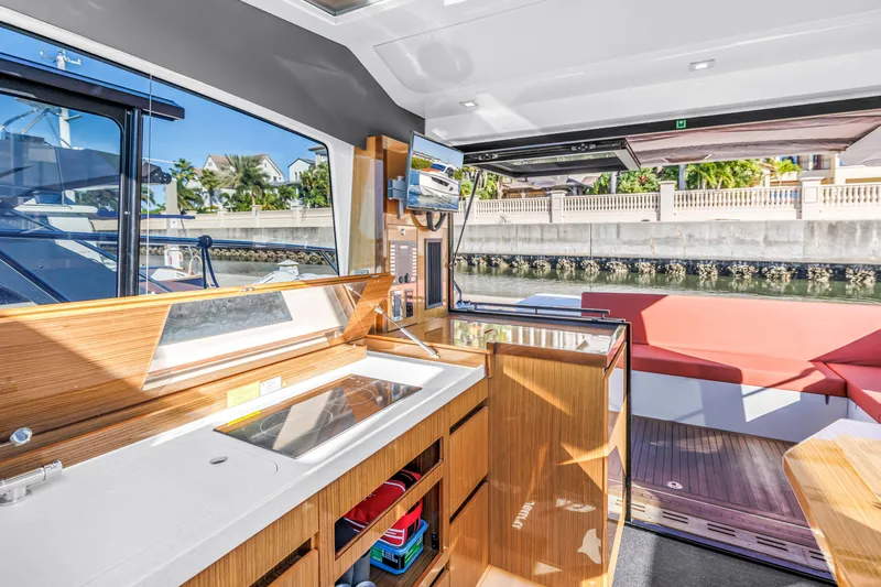  Yacht Photos Pics Interior of 2020 Sealine C390 yacht with modern kitchen and seating area.