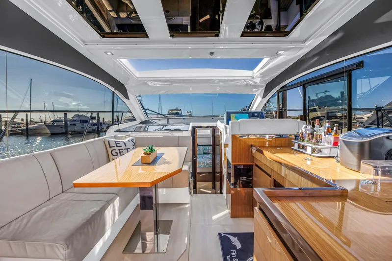  Yacht Photos Pics Luxurious interior of 2020 Sealine C390 yacht with elegant seating and bar area.