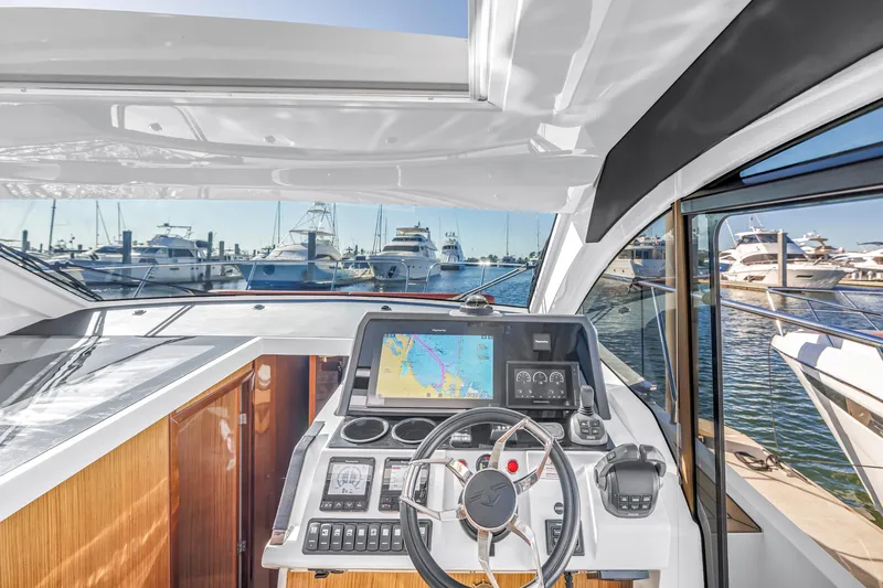  Yacht Photos Pics Helm of 2020 Sealine C390 yacht with navigation display, docked at marina.