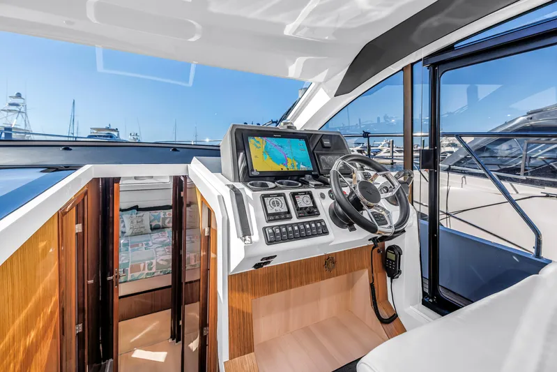  Yacht Photos Pics 2020 Sealine C390 yacht helm with navigation system and luxurious interior.