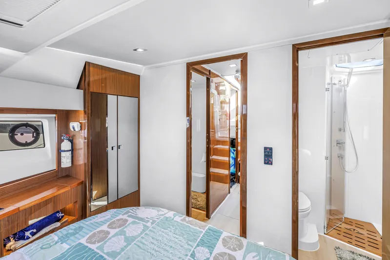  Yacht Photos Pics Luxurious interior of 2020 Sealine C390 yacht with modern bedroom and ensuite bathroom.