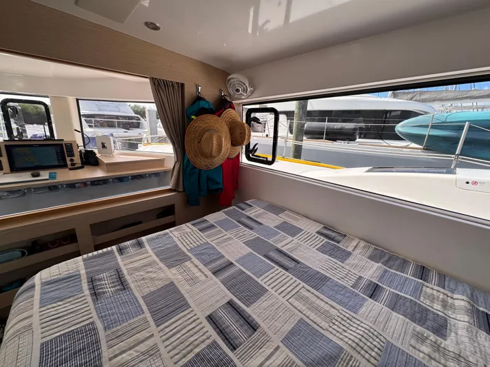 Encantado Yacht Photos Pics Interior of 2023 NEEL 47 yacht with cozy bedroom and marina view.