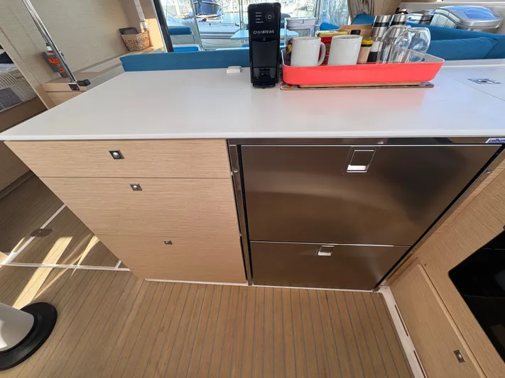 Encantado Yacht Photos Pics Modern kitchen area on a 2023 NEEL 47 yacht with sleek cabinetry and appliances.