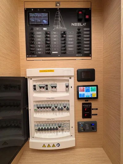 Encantado Yacht Photos Pics Electrical control panel of NEEL 47, 2023 model, with circuit breakers and digital displays.