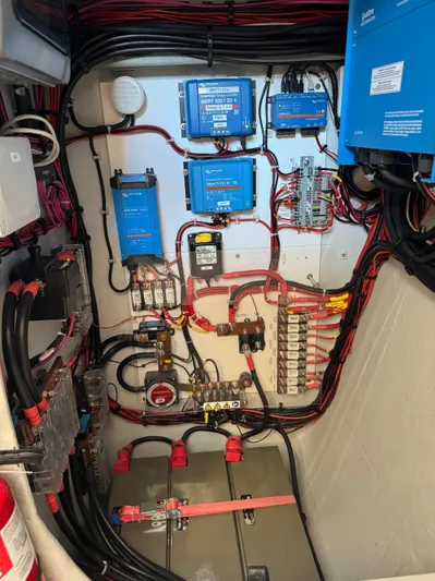 Encantado Yacht Photos Pics Electrical panel of a 2023 NEEL 47 with wiring and components.
