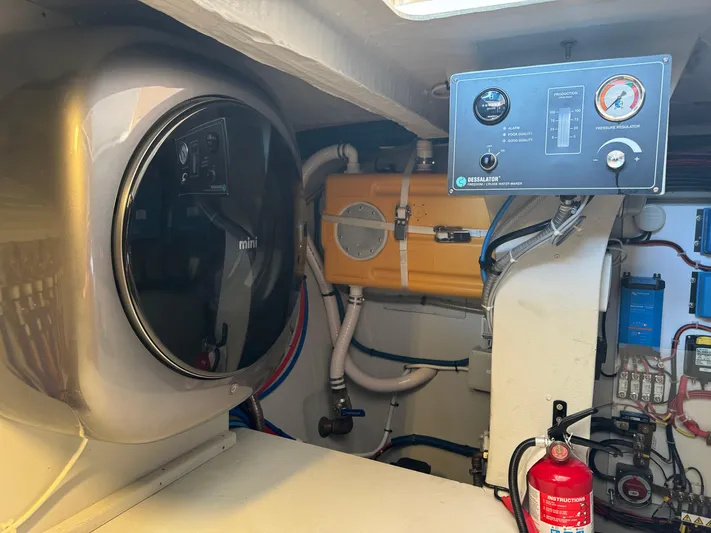 Encantado Yacht Photos Pics Engine room of 2023 NEEL 47 with control panel and safety equipment.