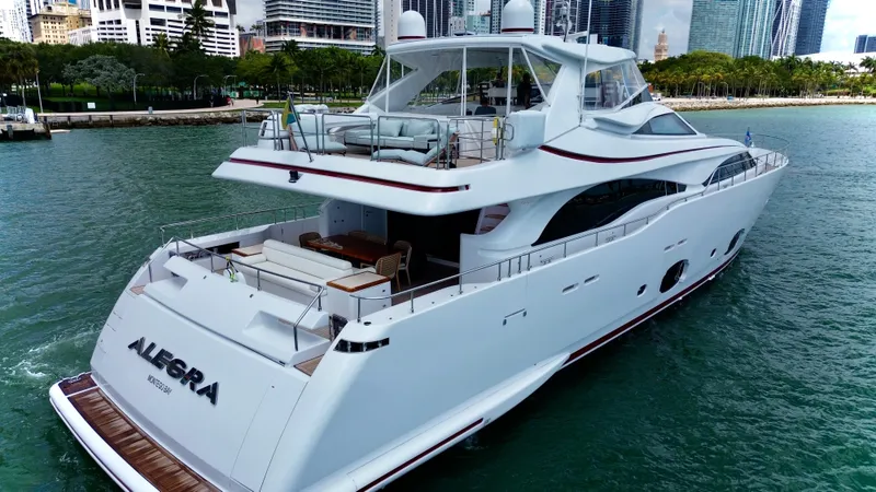  Yacht Photos Pics Luxurious 2016 Custom Line 97 yacht cruising near city skyline.