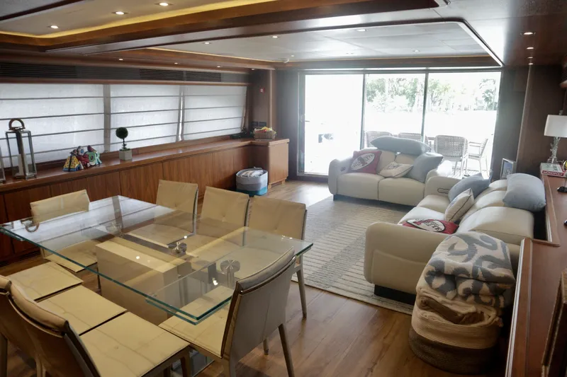  Yacht Photos Pics Luxurious interior of 2016 Custom Line 97 yacht with elegant dining and living area.
