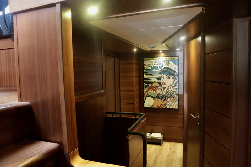  Yacht Photos Pics Luxurious wooden interior of 2016 Custom Line 97 yacht with modern artwork.