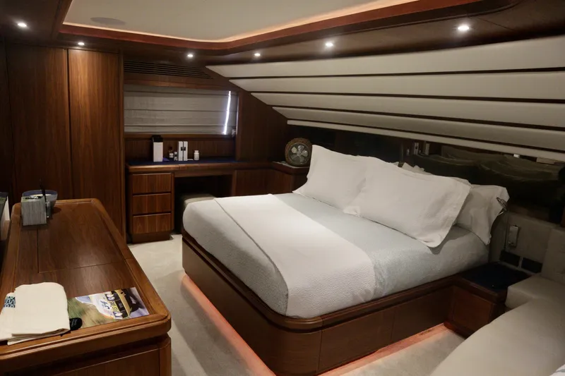  Yacht Photos Pics Luxurious bedroom interior on 2016 Custom Line 97 yacht with elegant wood finishes.