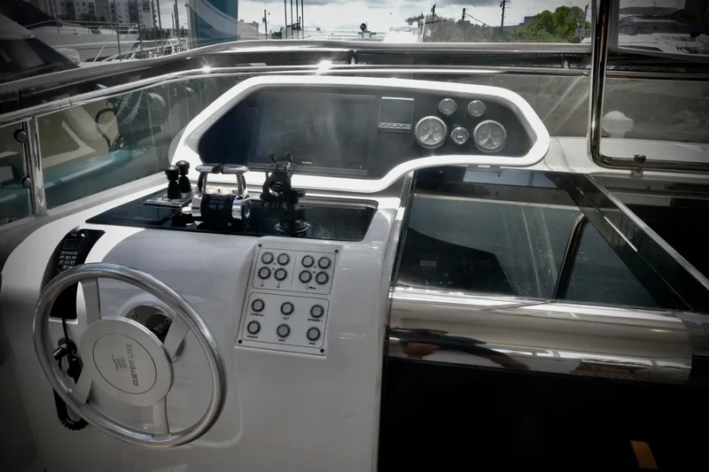  Yacht Photos Pics Helm of 2016 Custom Line 97 yacht with modern controls and steering wheel.