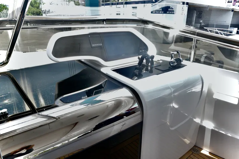  Yacht Photos Pics Helm station of 2016 Custom Line 97 yacht with sleek, modern design and controls.