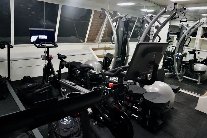  Yacht Photos Pics Fitness equipment in a modern gym aboard a 2016 Custom Line 97 yacht.