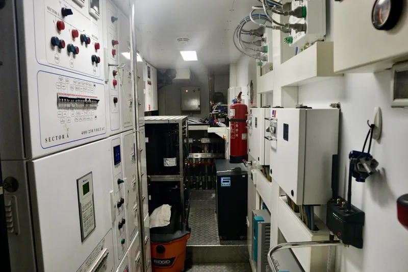  Yacht Photos Pics Control room of a 2016 Custom Line 97 yacht, featuring panels and equipment.