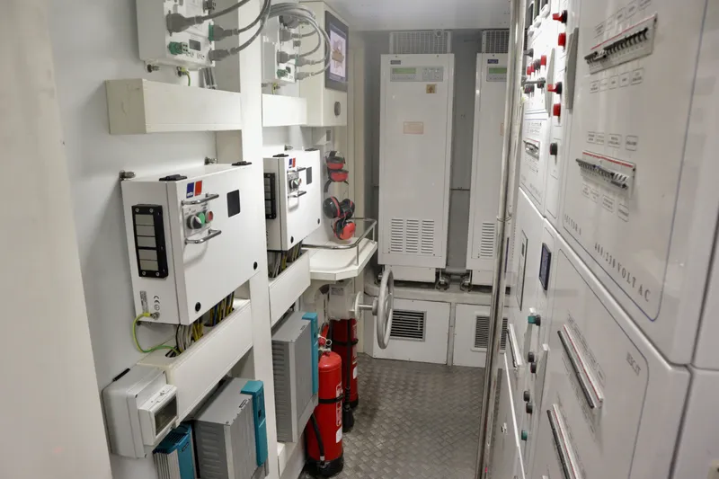  Yacht Photos Pics Electrical control room inside a 2016 Custom Line 97 yacht, featuring panels and safety equipment.