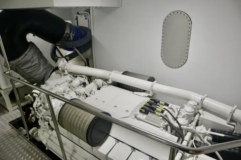  Yacht Photos Pics Engine room of 2016 Custom Line 97 yacht, showcasing mechanical components and piping.